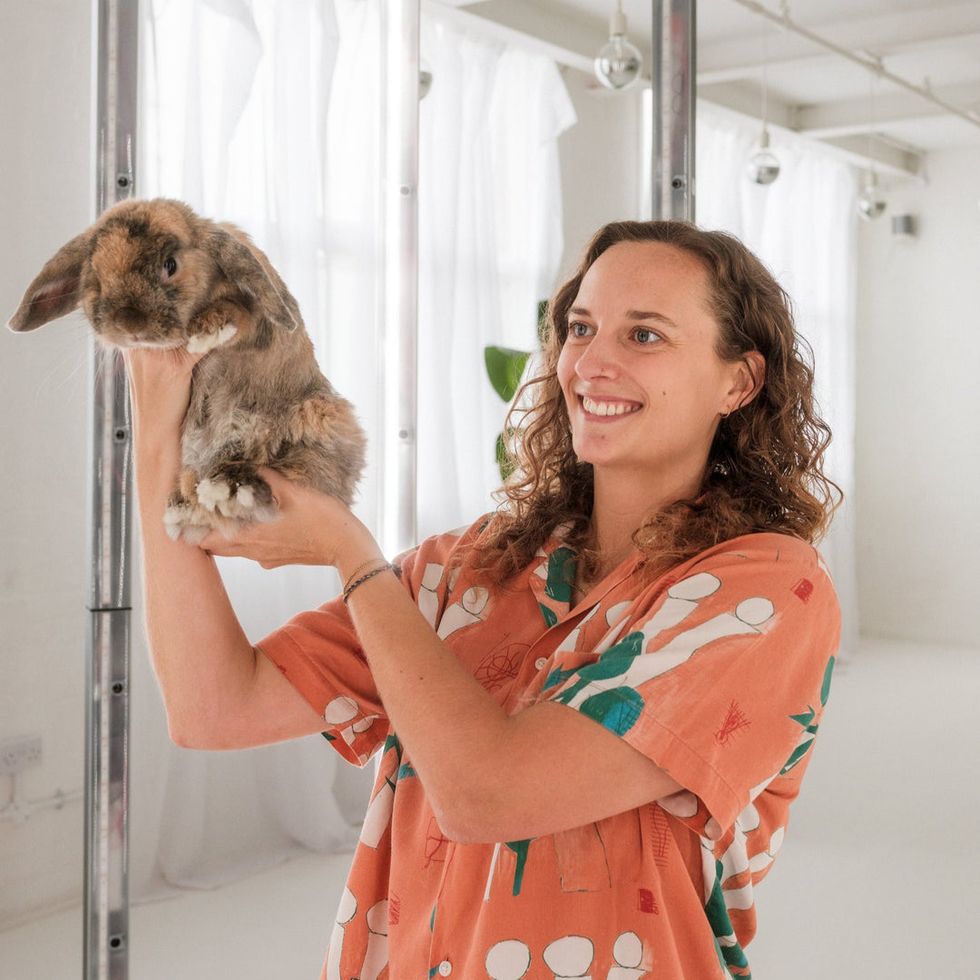 Woman and pet rabbit in 3D scanner