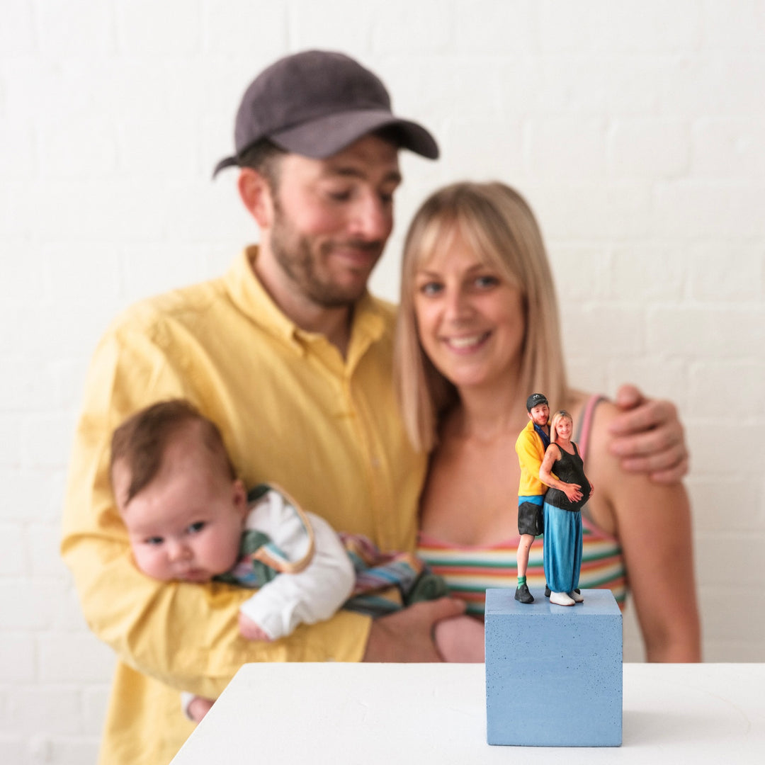 Family with 3D printed family portrait model
